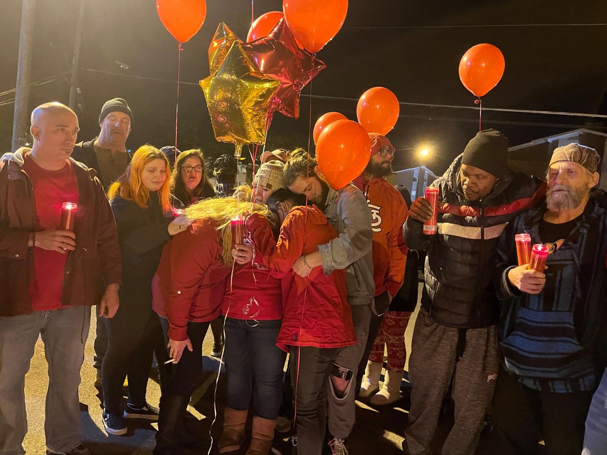 Family members of Zachary Fornash embrace during a vigil Thursday night for Fornash, who was shot and killed by a Canton police officer Tuesday night near the Skyland Terrace apartment complex in southeast Canton.