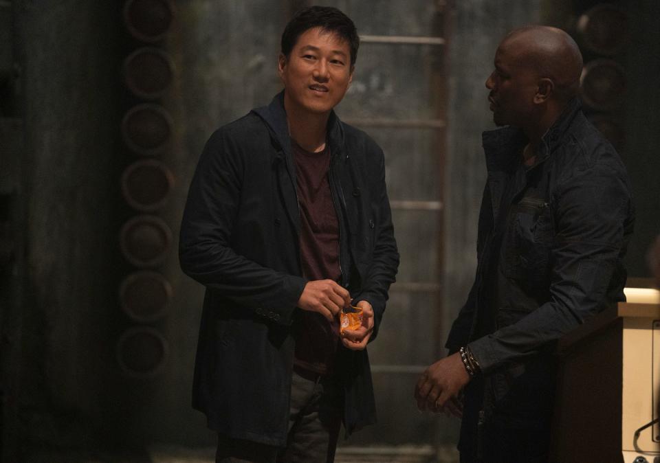 Han (Sung Kang, left, with Tyrese Gibson) returns to the "Fast and Furious" fold in "F9."