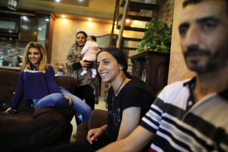 Palestinian Tamara Abu-Laban, 16, smiles during her interview with Reuters at her house in East Jerusalem October 8, 2017. Picture taken October 8, 2017. REUTERS/Ammar Awad