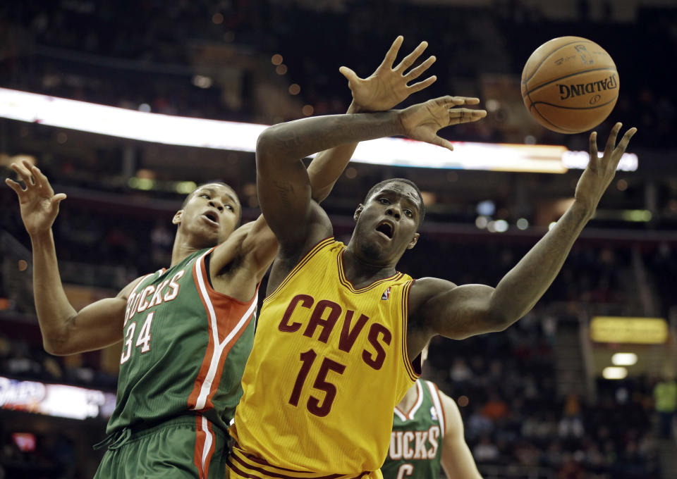 Cleveland Cavaliers' Anthony Bennett (15) fights for a rebound with Milwaukee Bucks' Giannis Antetokounmpo, from Greece, in the fourth quarter of an NBA basketball game, Friday, Jan. 24, 2014, in Cleveland. The Cavaliers won 93-78. (AP Photo/Mark Duncan)