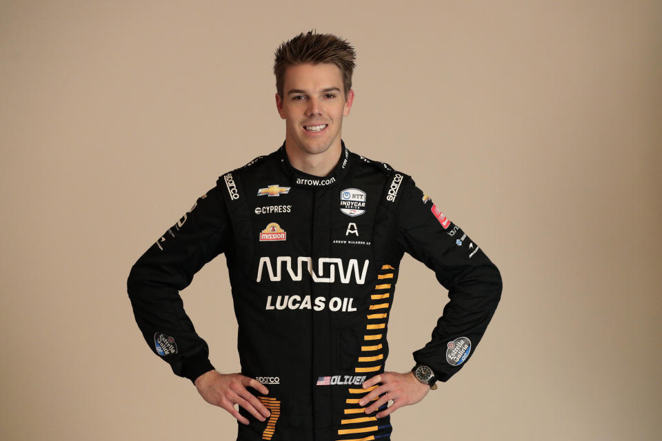 FILE - In this Feb. 10, 2020, file photo, IndyCar driver Oliver Askew poses for photos during IndyCar Media Day in Austin, Texas. The 2020 season will open Saturday night, June 6, at Texas Motor Speedway in NBC's first ever primetime IndyCar race. The rebranded Arrow McLaren SP team will debut with rookie Oliver Askew, last year's Indy Lights champion, and Pato O'Ward, who has returned to IndyCar after a brief stint last year racing in Europe. (AP Photo/Eric Gay, File)