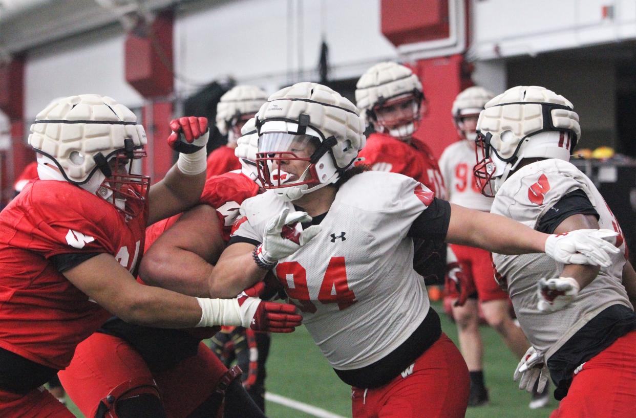 Wisconsin defensive lineman Elijah Hills (94) battles with an offensive lineman during the team's 14th spring practice Tuesday at the McClain Center in Madison.