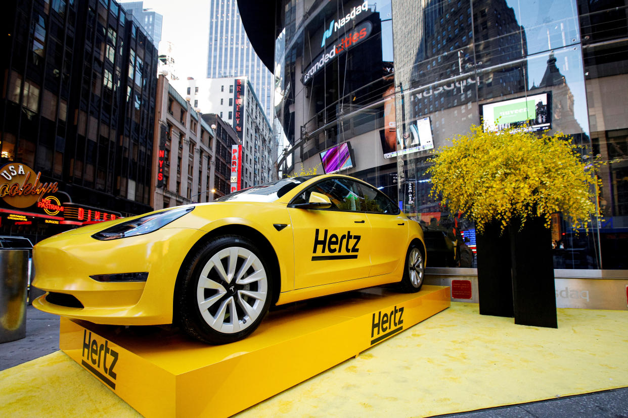 FILE PHOTO: A Hertz Tesla electric vehicle is displayed during the Hertz Corporation IPO at the Nasdaq Market site in Times Square in New York City, U.S., November 9, 2021. REUTERS/Brendan McDermid/File Photo