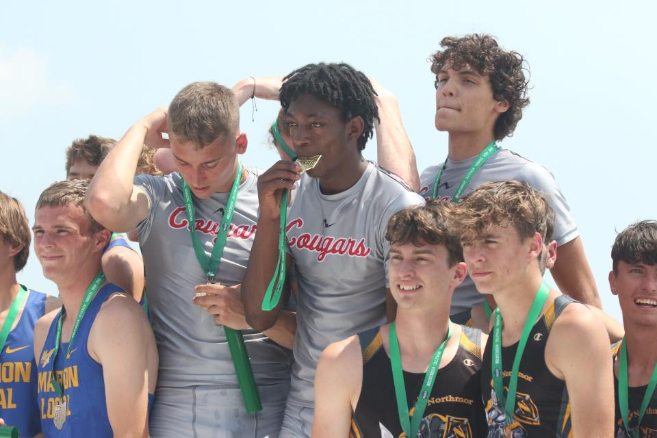 Crestview's Logan Friges (right) and Malachi Spoerr (left) celebrat their Division III 4x400 state championship.