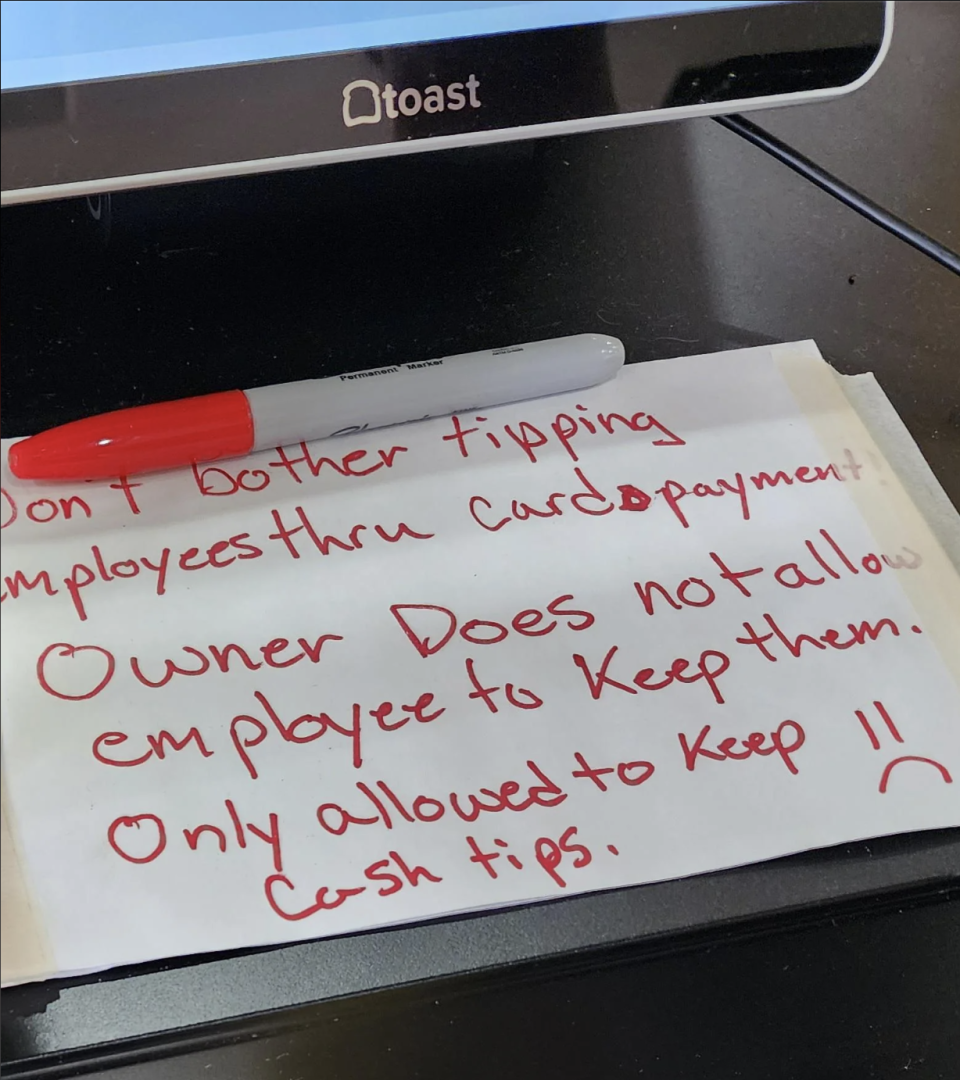 A note on a counter reads: "Don't bother tipping employees thru card payment. Owner does not allow employee to keep them. Only allowed to keep cash tips."