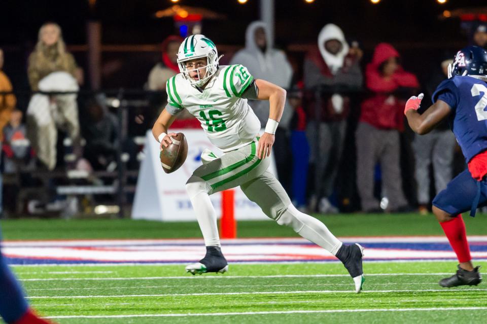 Quarterback Arch Manning 16 runs the ball as Newman takes on Lafayette Christian Academy in the LHSAA Div III semi finals.  Wednesday, Nov. 24, 2021.