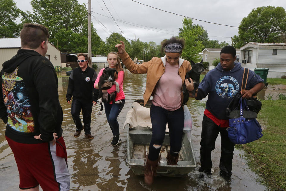 Woman helped out of boat