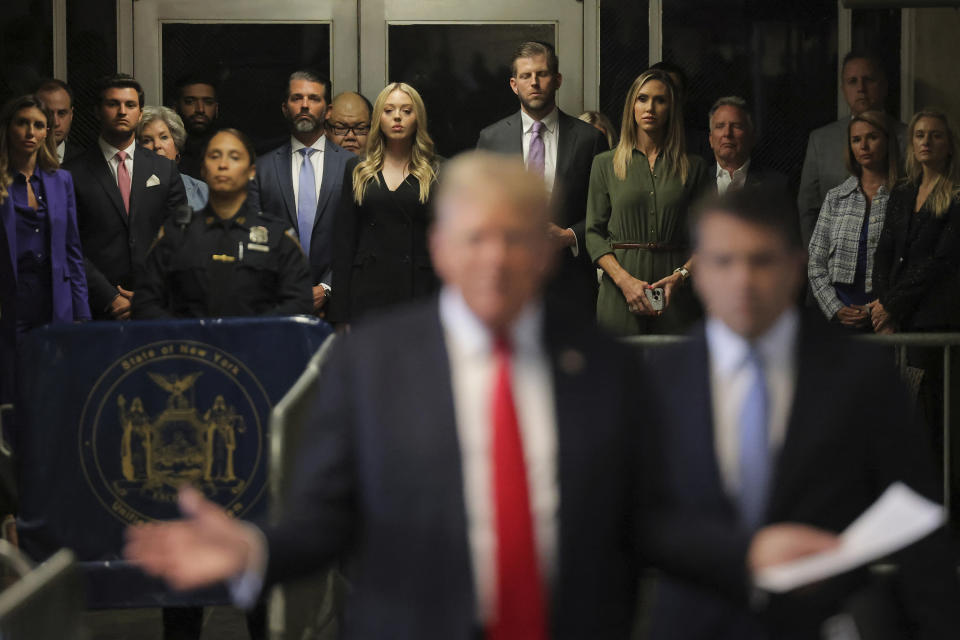 Former President Donald Trump's sons Eric Trump, Donald Trump Jr., daughter-in-law Lara Trump and Tiffany Trump look on at Manhattan criminal court before closing arguments in Trump's criminal hush money trial in New York, Tuesday, May 28, 2024. (Andrew Kelly/Pool Photo via AP)