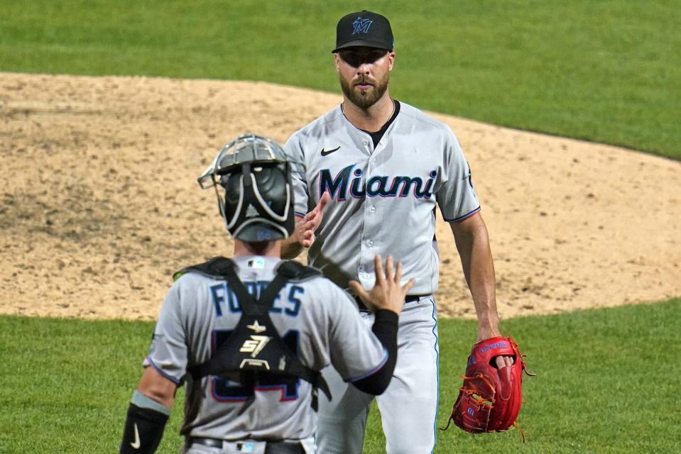 Marlins reliever Anthony Bass, celebrating with catcher Nick Fortes after a win over the Pirates last month, is now a member of the Toronto Blue Jays bullpen.
