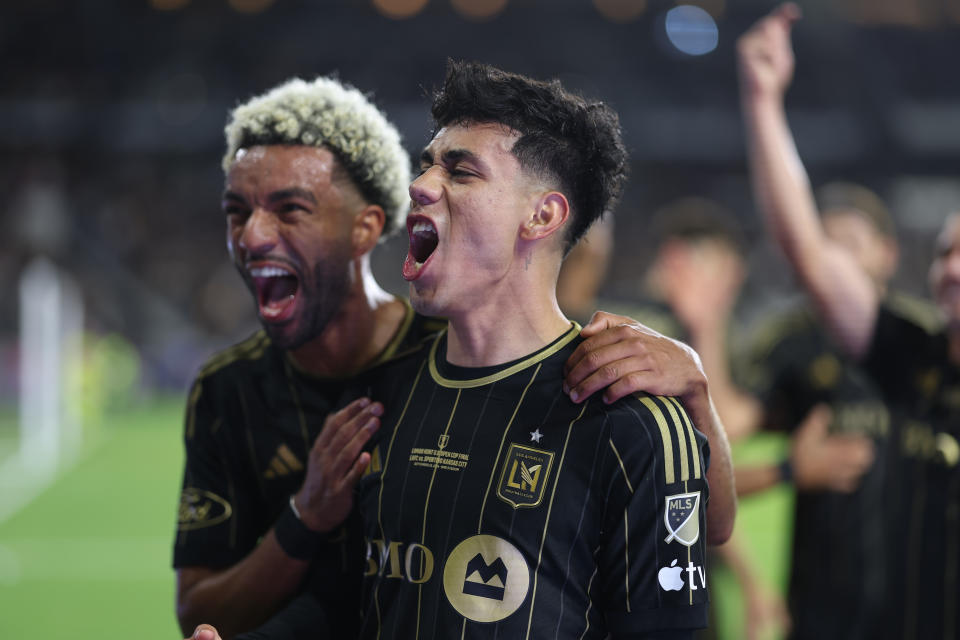 LOS ANGELES, CALIFORNIA - SEPTEMBER 25: Omar Campos #2 of Los Angeles FC celebrates his goal with Timothy Tillman #11 during extra time of the finals against Sporting Kansas City during the 2024 Lamar Hunt U. S. Open Cup at BMO Stadium on September 25, 2024 in Los Angeles, California.  (Photo by Michael Owens/USSF/Getty Images for USSF)