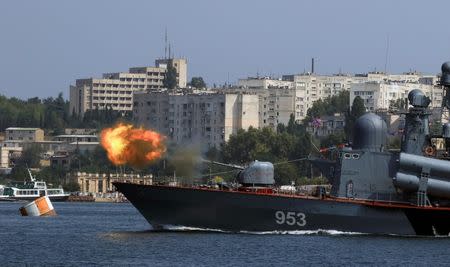 A missile corvette fires during the Navy Day celebrations in Sevastopol, Crimea, July 31, 2016. REUTERS/Pavel Rebrov