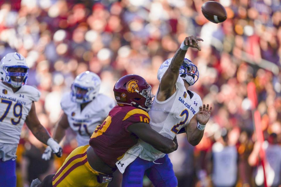 Jamil Muhammad tackles San Jose State quarterback Chevan Cordeiro during USC's win on Aug. 26.