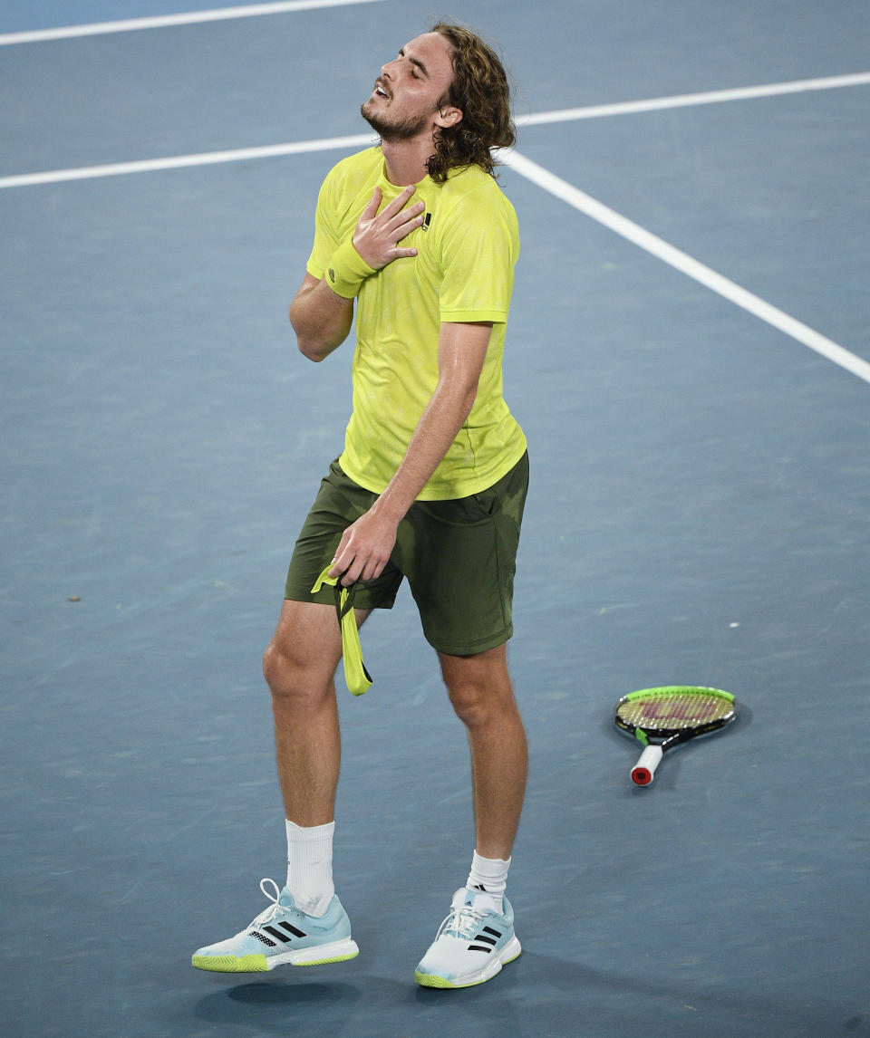 Greece's Stefanos Tsitsipas reacts after defeating Spain's Rafael Nadal in their quarterfinal match at the Australian Open tennis championship in Melbourne, Australia, Wednesday, Feb. 17, 2021.(AP Photo/Andy Brownbill)
