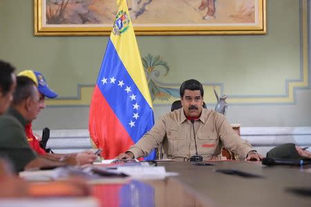 Venezuela's President Nicolas Maduro speaks during a meeting with ministers at Miraflores Palace in Caracas, Venezuela December 17, 2016. Miraflores Palace/Handout via REUTERS