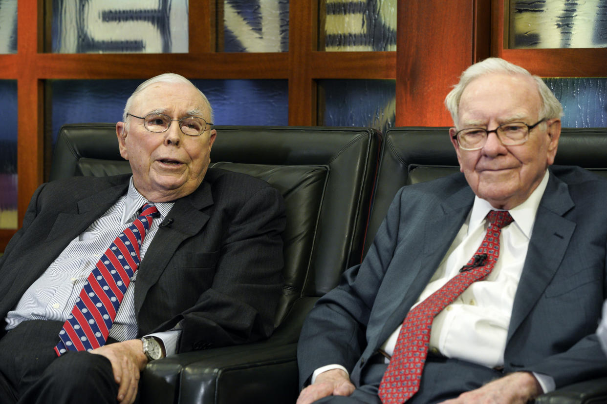 FILE - Berkshire Hathaway Chairman and CEO Warren Buffett, right, and his Vice Chairman Charlie Munger, left, speak during an interview in Omaha, Neb., Monday, May 7, 2018, with Liz Claman on Fox Business Network's 