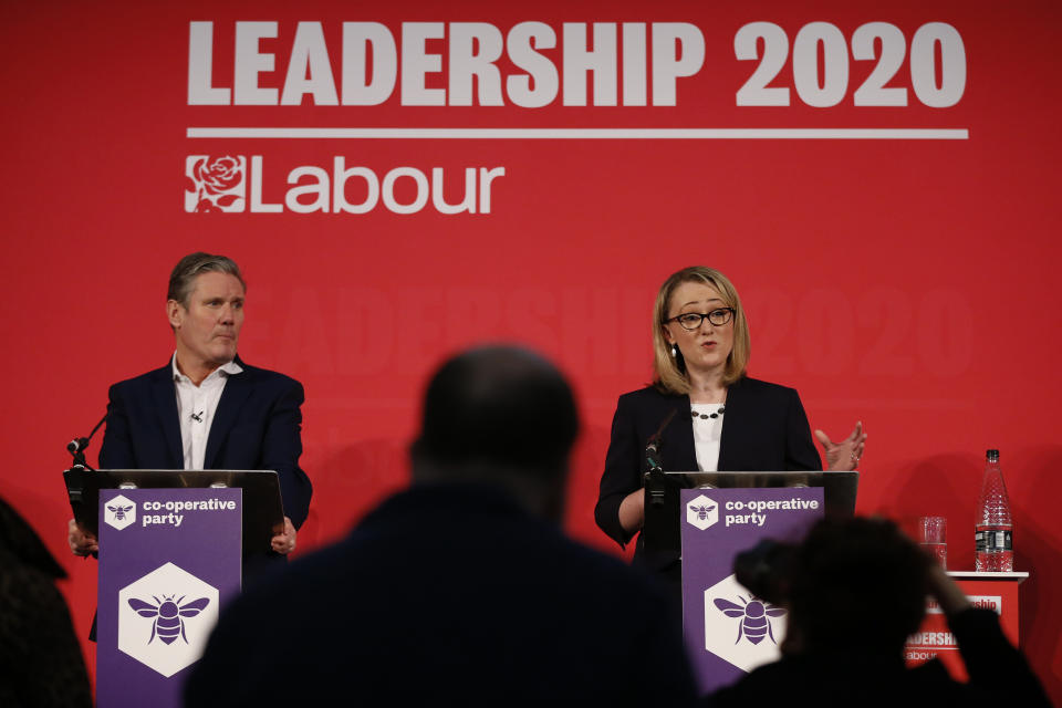 LONDON, ENGLAND - FEBRUARY 16: Sir Keir Starmer listens to Rebecca Long-Bailey speaking at a hustings event for Labour Leader and Deputy Leader, hosted by the Co-operative Party, at the Business Design Centre on February 16, 2020 in London, England. Sir Keir Starmer, Rebecca Long-Bailey and Lisa Nandy are vying to replace Labour leader Jeremy Corbyn, who offered to step down following his party's loss in the December 2019 general election. (Photo by Hollie Adams/Getty Images)