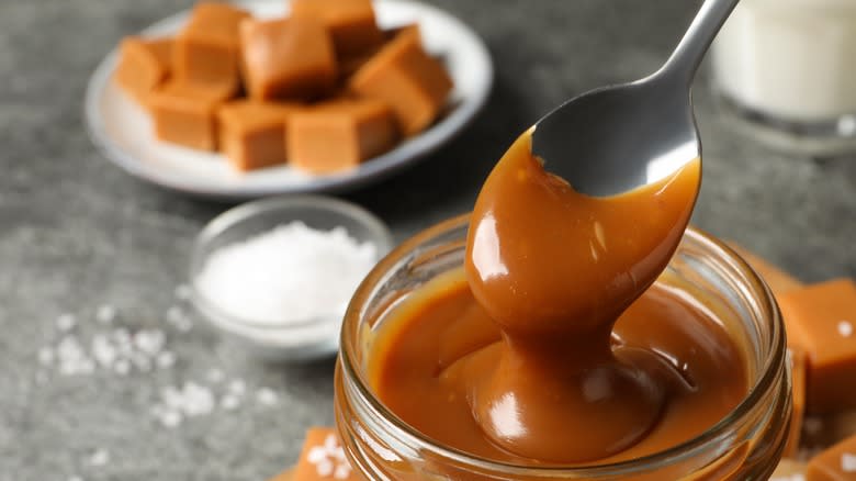 Caramel sauce jar with spoon