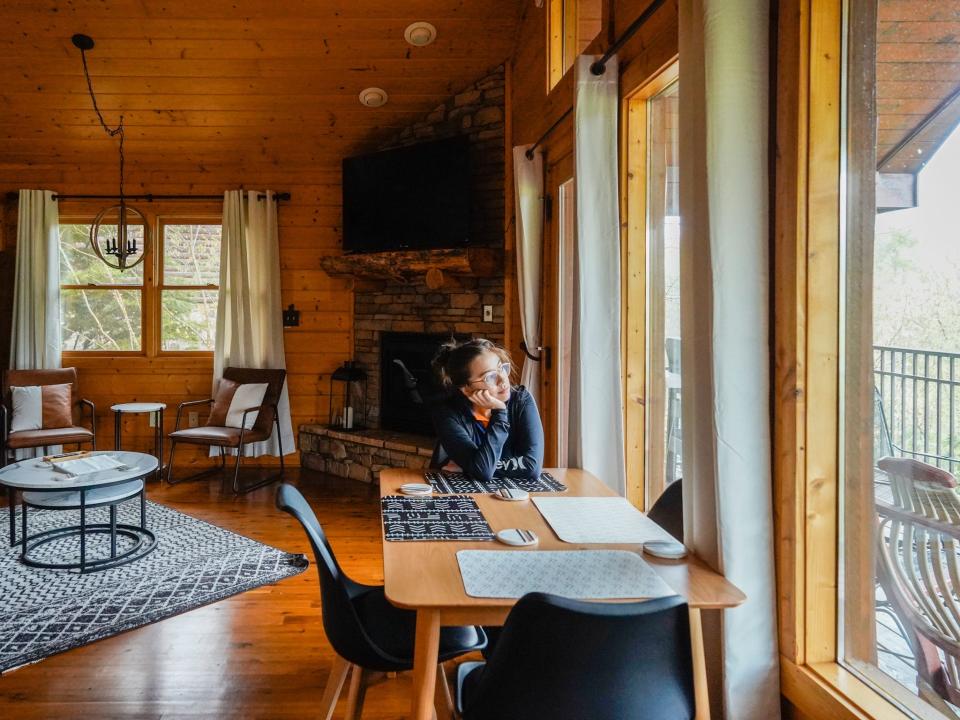 The author looks out the window from a cabin in Gatlinburg, Tennessee.
