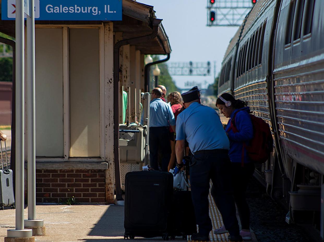 Travelers depart the Carl Sandburg train at the Galesburg Amtrak Depot on Saturday, June 18, 2022. Amtrak is cutting back the morning trains during the holidays due to staffing issues.