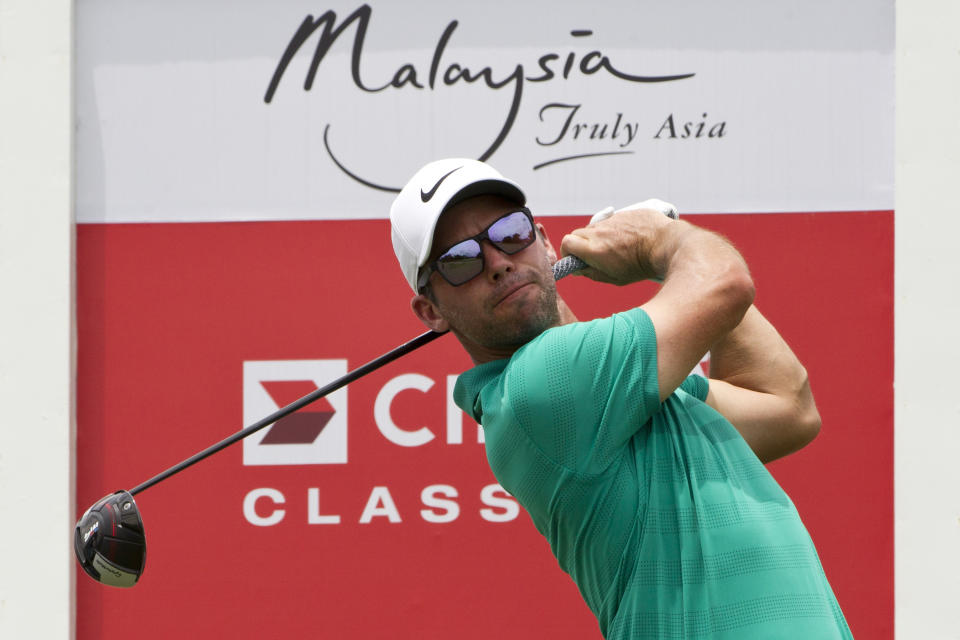 Paul Casey of England follows his shot on the eighteenth hole during round two of the CIMB Classic golf tournament at Tournament Players Club (TPC) in Kuala Lumpur, Malaysia, Friday, Oct. 12, 2018. (AP Photo/Yam G-Jun)