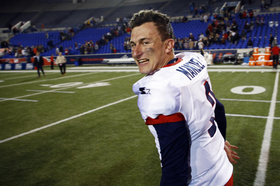 FILE - In this March 24, 2019, file photo, Memphis Express quarterback Johnny Manziel celebrates as he leaves the field after an AAF football game at Liberty Bowl Memorial Stadium in Memphis, Tenn. If you’re really looking for something different: a fan-controlled football league is launching this weekend. It's sort of a video game meets pro wrestling meets arena football, allowing viewers to actually call plays for none other than Manziel. (AP Photo/Wade Payne, File)