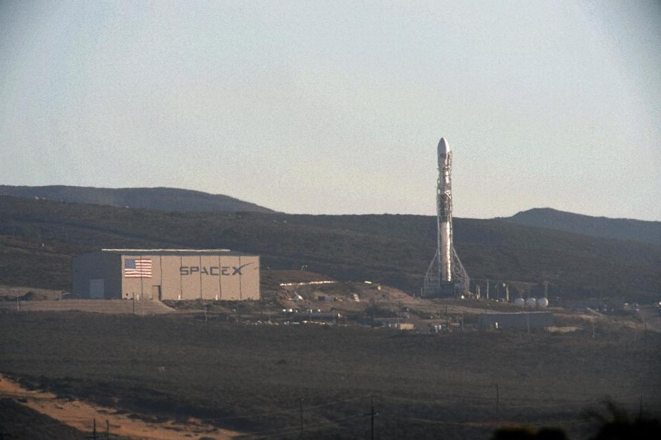 A SpaceX upgraded Falcon 9 rocket undergoes launch preparations at Vandenberg Air Force Base in California September 27, 2013. Privately owned Space Exploration Technologies plans to test an upgraded Falcon 9 rocket on Sunday from a site in California as part of its push into the satellite launch market. Perched on top of the 22-story, beefed-up Falcon 9 will be Canada�s Cassiope science satellite. Liftoff is targeted for 9 a.m. PDT (1600 GMT). �This is essentially a development flight for the rocket,� company founder and chief executive Elon Musk told Reuters. REUTERS/Gene Blevins (UNITED STATES - Tags: SCIENCE TECHNOLOGY BUSINESS)