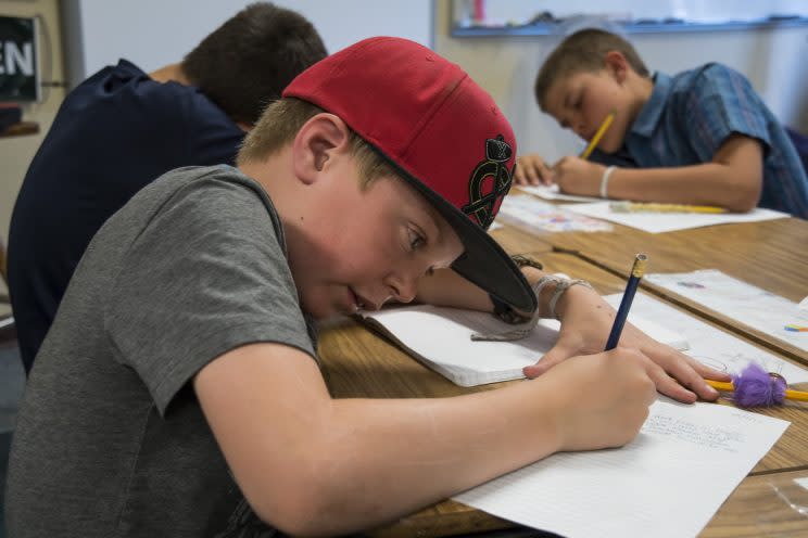 Ben Rosenberg, 11, of Boulder, Colo., writes a letter to children in the Dadaab Refugee Camp in Kenya. (Photo: Carey Wagner/CARE)