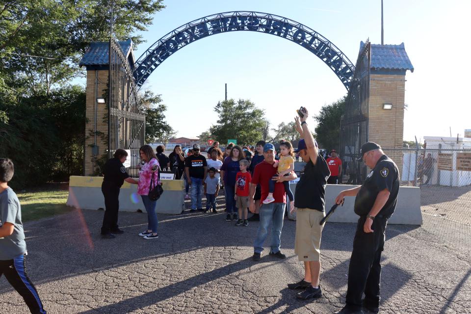 Security runs metal detectors over everyone as they enter the Tri-State Fair Tuesday evening at the fairgrounds.