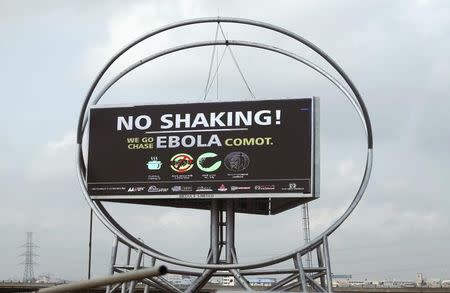 A billboard that raises awareness and fight against Ebola is seen in Lagos October 27, 2014. REUTERS/Akintunde Akinleye