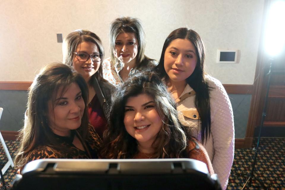 Sabrina Saenz (lower right) and family try out a 360 degree photo booth at the 2023 Amarillo Bridal Show held at the Amarillo Civic Center Sunday afternoon.