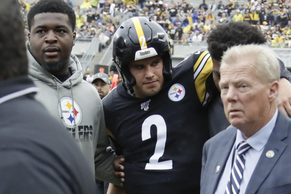 Pittsburgh Steelers quarterback Mason Rudolph (2) is helped from the field after he was injured in the second half of an NFL football game against the Baltimore Ravens, Sunday, Oct. 6, 2019, in Pittsburgh. (AP Photo/Gene J. Puskar)