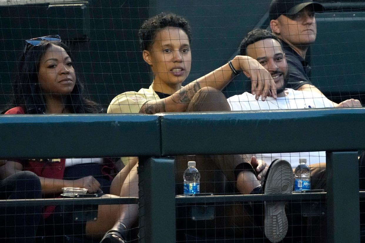 WNBA player Brittney Griner watches the game between the Arizona Diamondbacks and the Milwaukee Brewers in the first inning at Chase Field in Phoenix on April 11, 2023.