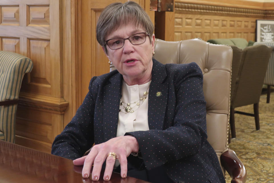 In this Thursday, Jan. 2, 2020 photo, Kansas Gov. Laura Kelly answers questions during an Associated Press interview in her Statehouse office in Topeka, Kansas. The Democratic governor and a top Republican legislator are preparing unveil a bipartisan plan for expanding Medicaid in Kansas. (AP Photo/John Hanna)