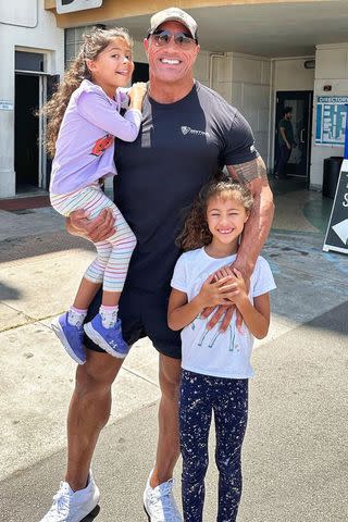 <p>Dwayne Johnson/Instagram</p> Dwayne Johnson with two of his three daughters