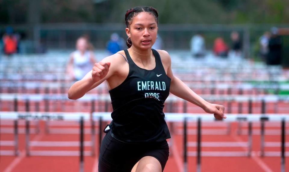 Emerald Ridge freshman JaiCieonna Gero-Holt runs to victory in the girls 100-meter hurdles at the South Sound Track & Field Classic at Sparks Stadium in Puyallup. Washington, on Saturday, April 16, 2022.