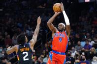 Detroit Pistons forward Jerami Grant (9) shoots over Phoenix Suns guard Elfrid Payton (2) during the first half of an NBA basketball game Thursday, Dec. 2, 2021, in Phoenix. (AP Photo/Ross D. Franklin)