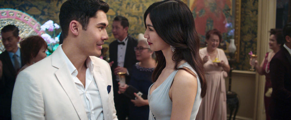 Henry Golding and Chan play cousins Nick and Astrid in <em>Crazy Rich Asians</em>. (Photo: Warner Bros. Pictures/courtesy Everett Collection)