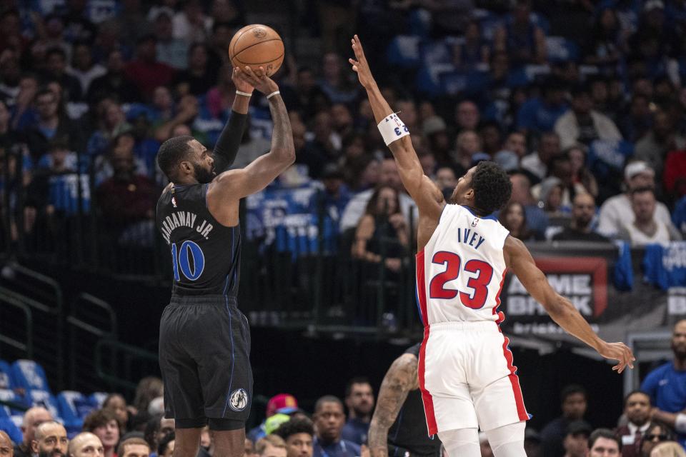 Dallas Mavericks forward Tim Hardaway Jr. (10) goes up to shoot over Detroit Pistons guard Jaden Ivey (23) during the first half of an NBA basketball game Friday, April 12, 2024, in Dallas. (AP Photo/Jeffrey McWhorter)