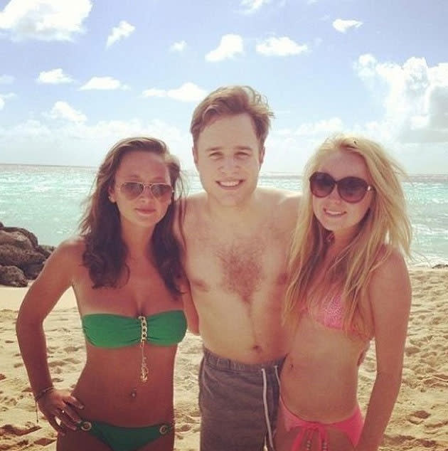 Celebrity Twitpics: Olly Murs also enjoyed a beach holiday this week, with the popstar tweeting this photo of himself on the beach with two fans.