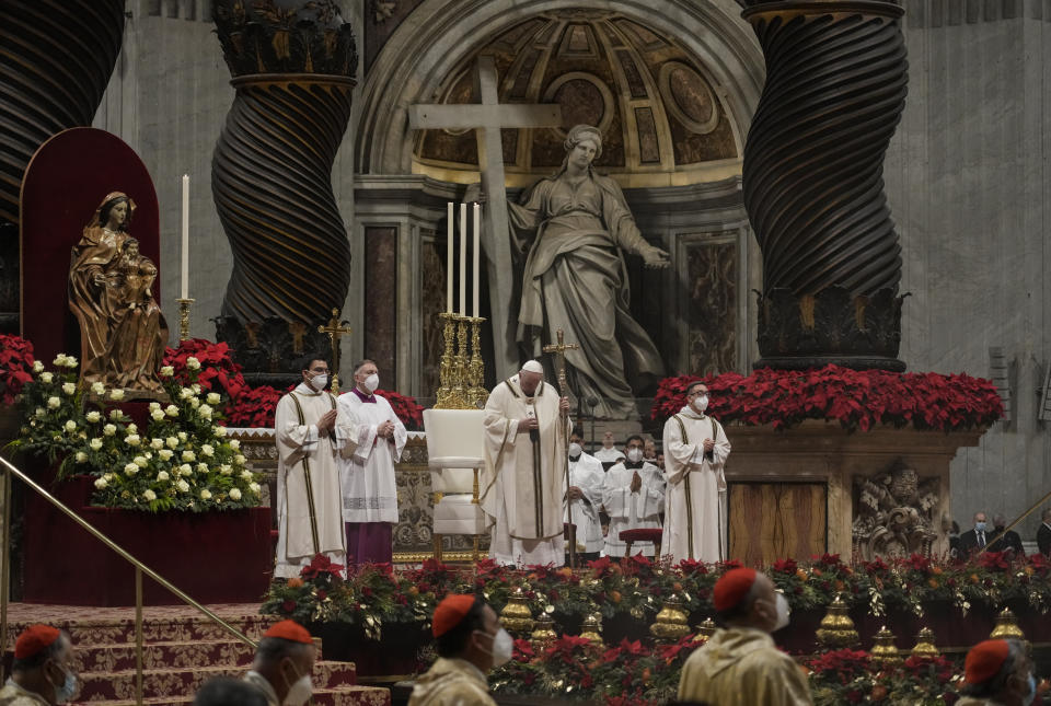 Pope Francis celebrates Christmas Eve Mass, at St. Peter's Basilica, at the Vatican, Friday Dec. 24, 2021. Pope Francis is celebrating Christmas Eve Mass before an estimated 1,500 people in St. Peter's Basilica. He's going ahead with the service despite the resurgence in COVID-19 cases that has prompted a new vaccine mandate for Vatican employees. (AP Photo/Alessandra Tarantino)