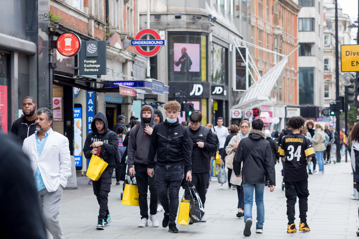 Shoppers seen walking with shopping bags along Bond Street in London. (Photo by Belinda Jiao / SOPA Images/Sipa USA)