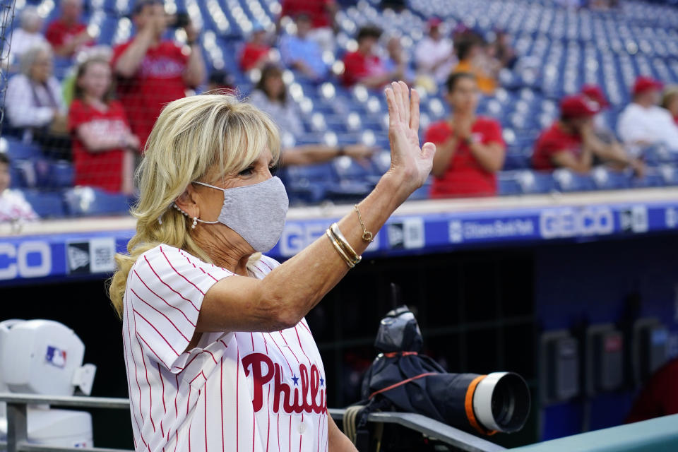 FILE - First lady Jill Biden waves while participating in the Philadelphia Phillies' sixth annual "Childhood Cancer Awareness Night" before a baseball game against the Washington Nationals, Sept. 9, 2022, in Philadelphia. (AP Photo/Matt Slocum, File)