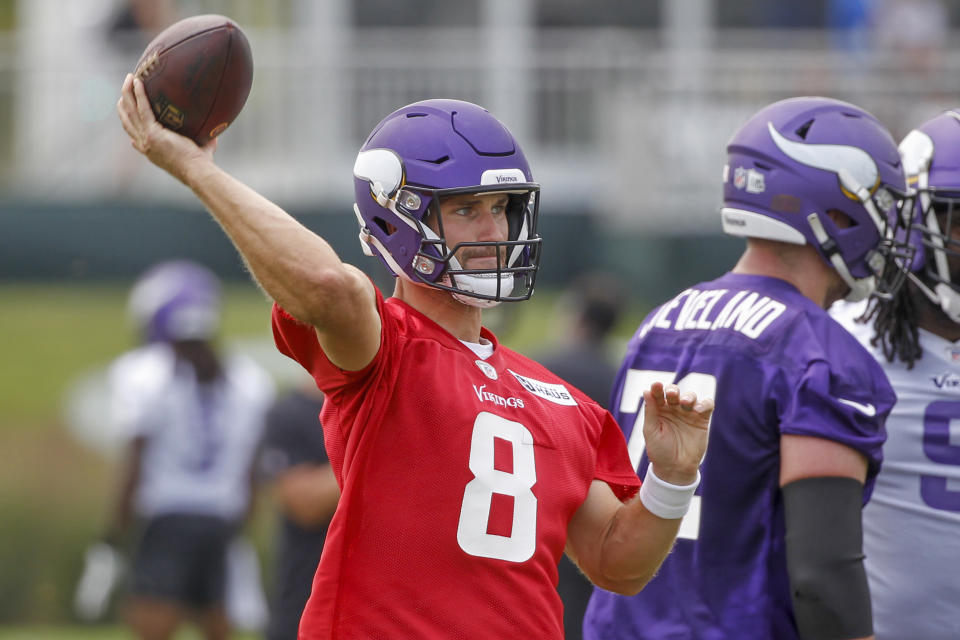 Minnesota Vikings quarterback Kirk Cousins throws during NFL football training camp Wednesday, July 28, 2021, in Eagan, Minn. (AP Photo/Bruce Kluckhohn)