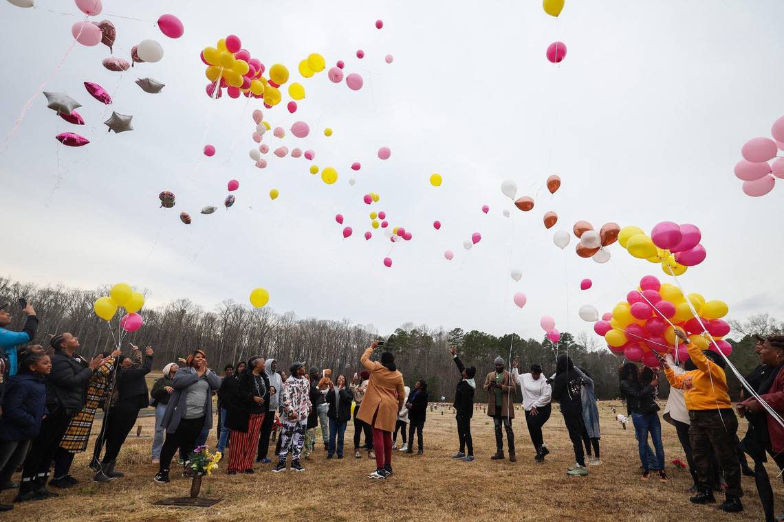 Balloons are released by family and friends to honor Shanquella Robinson, who died under suspicious circumstances in Cabo, Mexico on Oct. 29, 2022. In honor of what would have been her 26th birthday on Monday, family and friends gathered at Beatties Ford Memorial Garden, where she is buried, on Sunday, January 8, 2023.