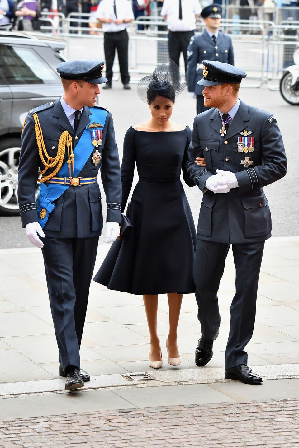 <p>The day after <a href="https://www.cosmopolitan.com/uk/fashion/celebrity/a22090812/meghan-markle-dress-prince-louis-christening/" rel="nofollow noopener" target="_blank" data-ylk="slk:Prince Louis' christening;elm:context_link;itc:0;sec:content-canvas" class="link ">Prince Louis' christening</a>, Meghan attended the RAF centenary service at Westminster Abbey in a <a href="https://www.cosmopolitan.com/uk/fashion/celebrity/a22099635/meghan-markle-raf-centenary-service-dior-black-dress/" rel="nofollow noopener" target="_blank" data-ylk="slk:navy fit and flare Dior dress;elm:context_link;itc:0;sec:content-canvas" class="link ">navy fit and flare Dior dress</a>, that marked a completely different silhouette style for the Duchess. Meghan teamed it with another dramatic headpiece, designed by British milliner Stephen Jones and a pair of nude heels.</p>