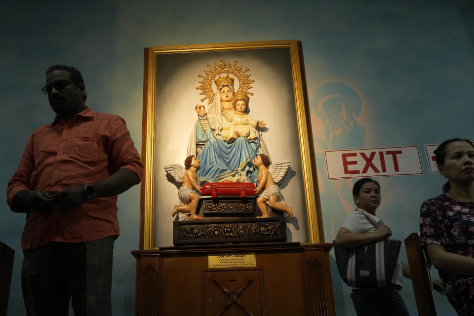 People take part in a liturgy at the Catholic Church, Our Lady of the Rosary, at the Religious complex, in Doha, Qatar, Friday, Dec. 9, 2022. (AP Photo/Thanassis Stavrakis)