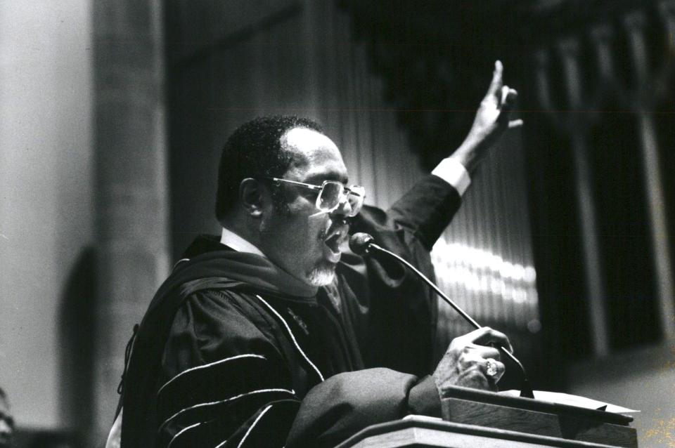 Rev. Charles Adams, Hartford Memorial Baptist Church, Detroit. Rev. raises his hand during a reading of scriptures. Adams was known as one of Black America's greatest preachers.
