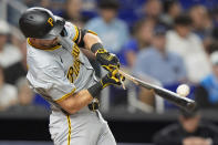 Pittsburgh Pirates' Jared Triolo breaks his bat as he hits during the third inning of a baseball game against the Miami Marlins, Friday, March 29, 2024, in Miami. (AP Photo/Wilfredo Lee)