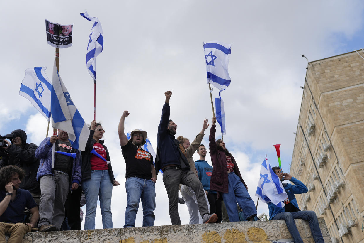 Israelis protest against Prime Minister Benjamin Netanyahu's judicial overhaul plan outside the parliament in Jerusalem, Monday, March 27, 2023. (AP Photo/Ohad Zwigenberg)