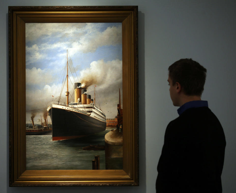 A visitor to SeaCity Museum looks at a painting displayed at the museum's Titanic exhibition on April 3, 2012 in Southampton, England. The new SeaCity Museum, which will open at 1.30pm on April 10, 100 years to the day since the Titanic set sail from the city. The museum, which cost 15 GBP million, promises to tell the largely untold story of Southampton's Titanic crew and the impact the tragedy had on the city, as well as featuring other aspects of the city's seafaring past. (Photo by Matt Cardy/Getty Images)